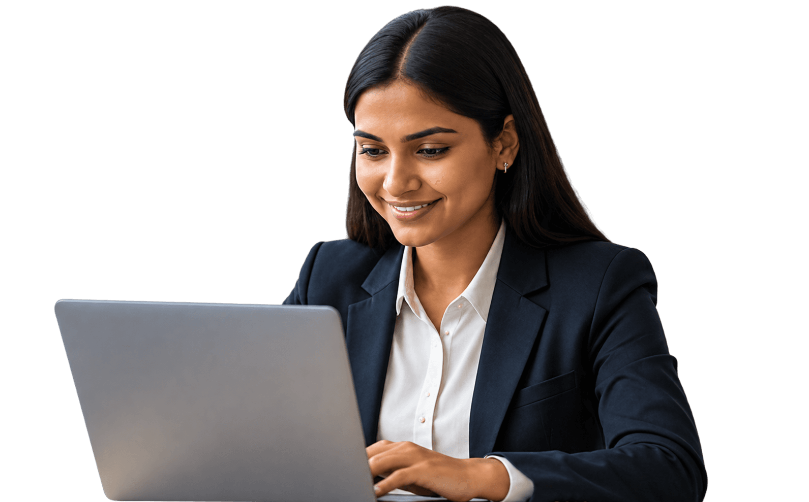 A professional smiling as she works on a laptop