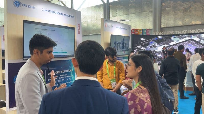 The Tryzent team demonstrating to visitors at their India Mobile Congress stall
