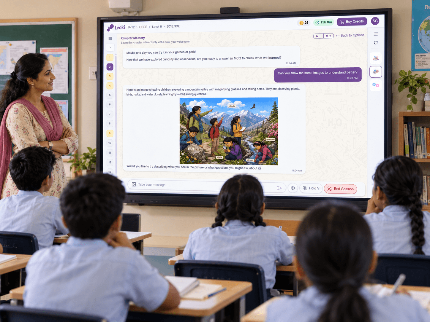 Leoki teaching a chapter on the classroom screen while the teacher supervises